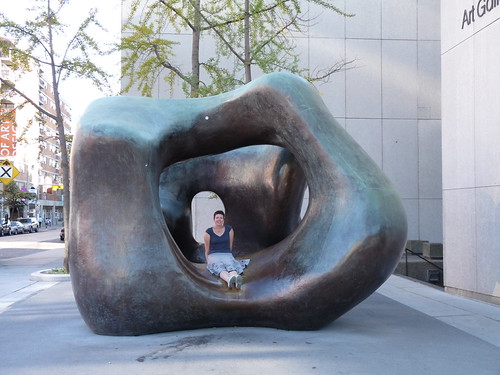 Claire sat in a Henry Moore sculpture