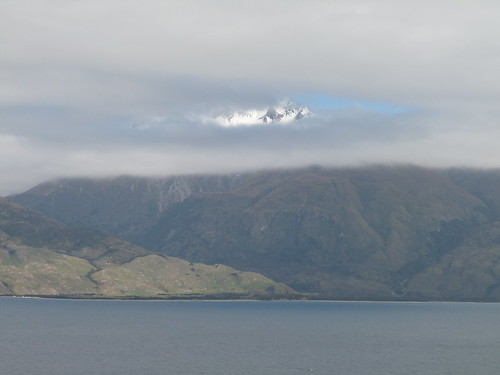 Mount Aspiring through the clouds beyond Lake Wanaka