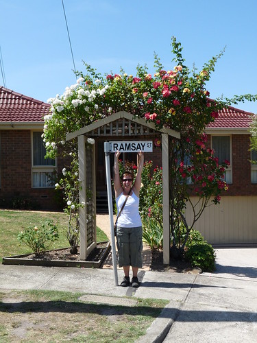 Claire with the Ramsey Street sign