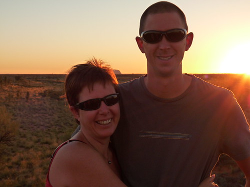 Us at sunrise with Uluru (just)