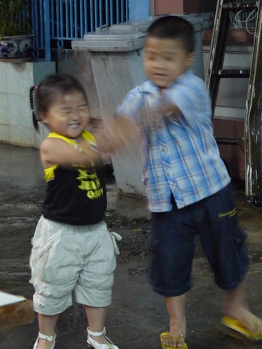 Local children enjoying the rain