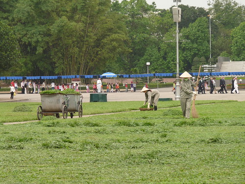 Cutting the grass by hand outside Ho Chi Minh’s Mausoleum