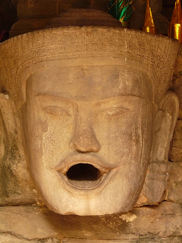 Human gargoyle feeing one of the outer lakes at Neak Prean